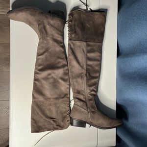 Brown suede boot above the knee.